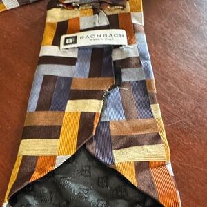Bachrach Geometric Patterned Tie in Brown, Blue, and Orange underside damage
